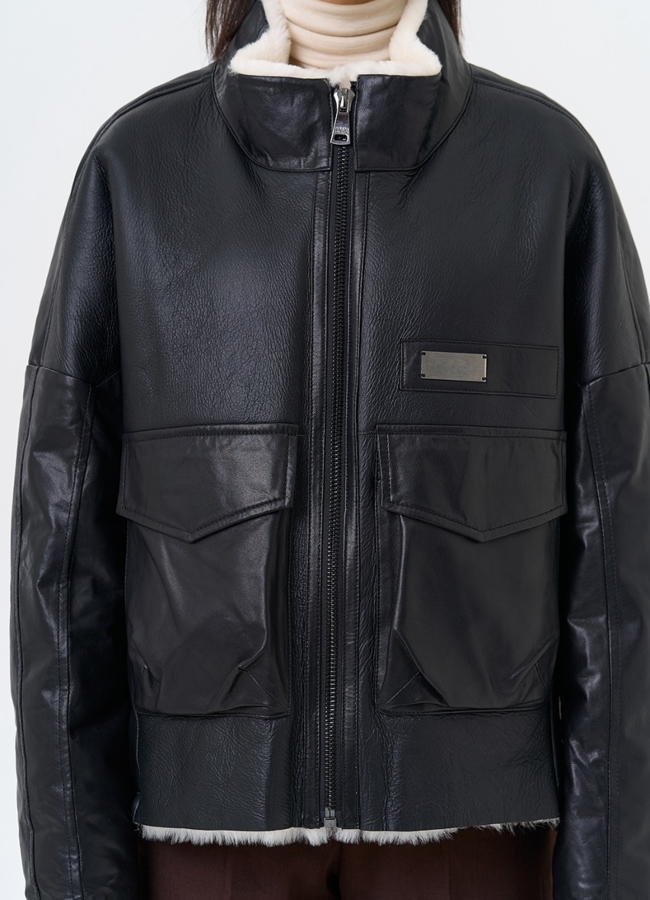 Женский пуховик из натуральной кожи с отделкой из овчины модель № 28577 универмаг малина