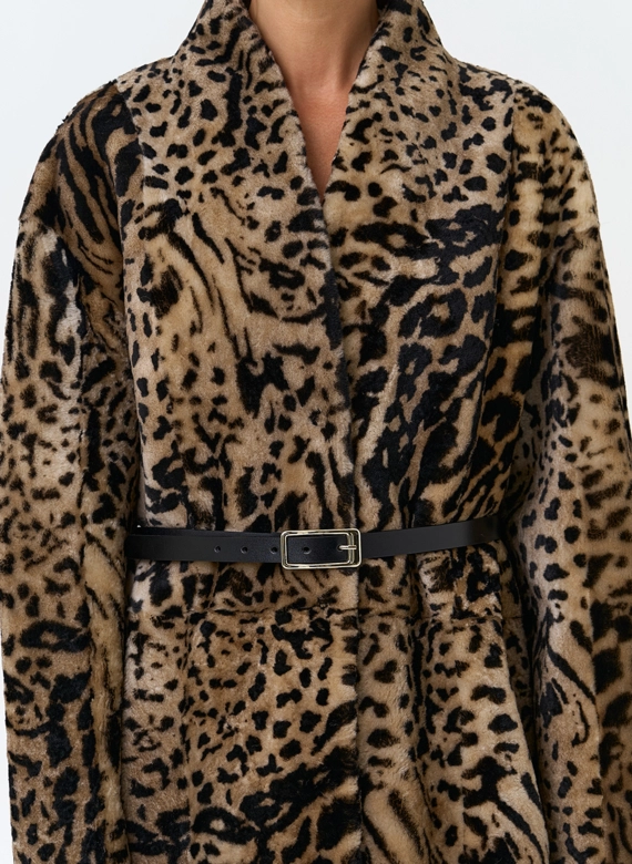 Двухсторонняя женская дубленка с декоративным поясом фото